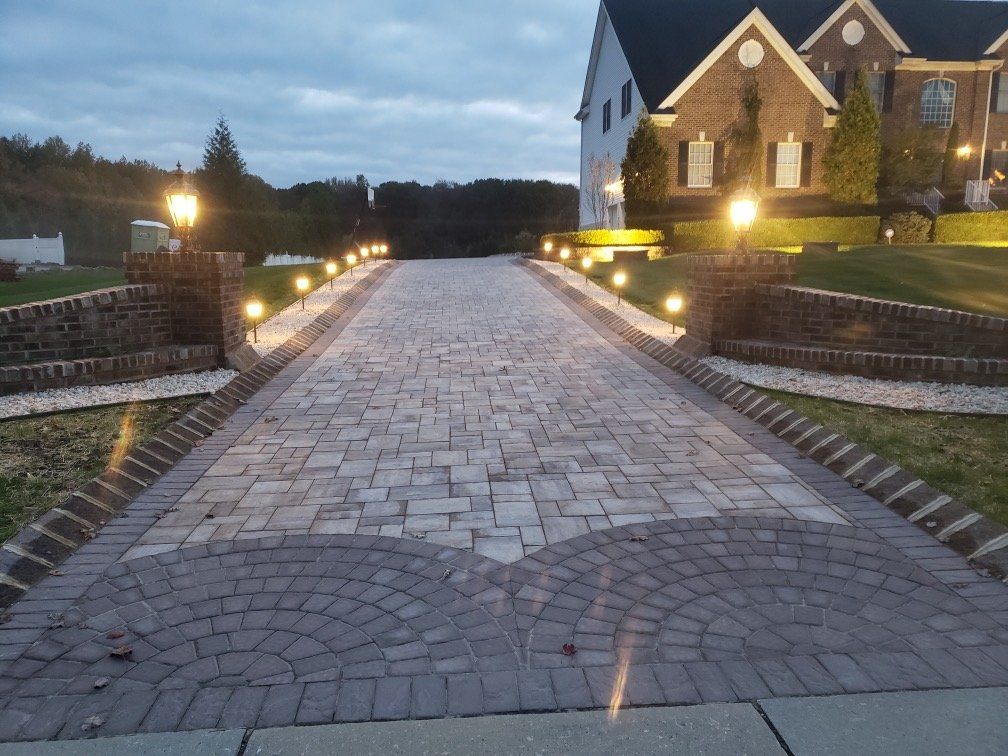 Close view of the paver pattern and border at dusk