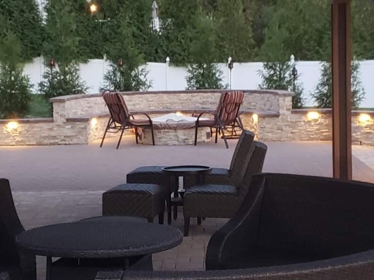 Outdoor paver patio with curved stone seating