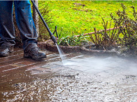 Pressure cleaning an outdoor paver surface